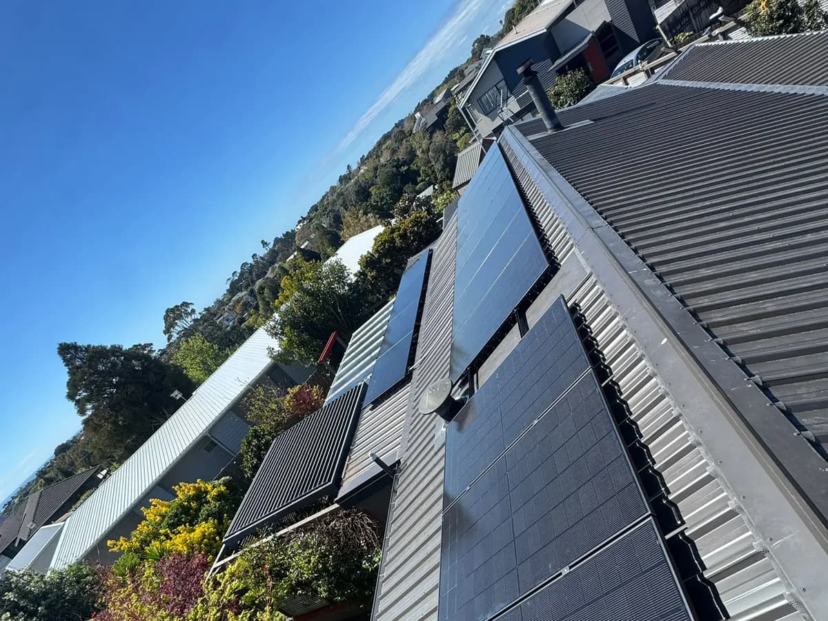 A 6.83kW EFS Solar array on a metal roof in New Plymouth, Taranaki, on a leafy hillside