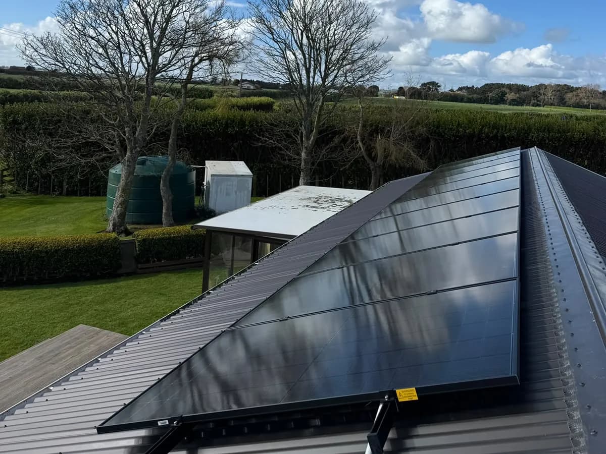 A 9.1kW EFS Solar array on a rural home at Normanby, Taranaki, with paddocks behind