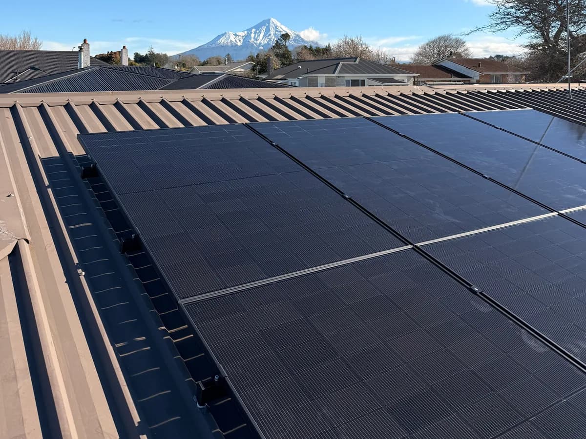 A 6.8kW EFS Solar array on a Stratford roof with Mount Taranaki behind it